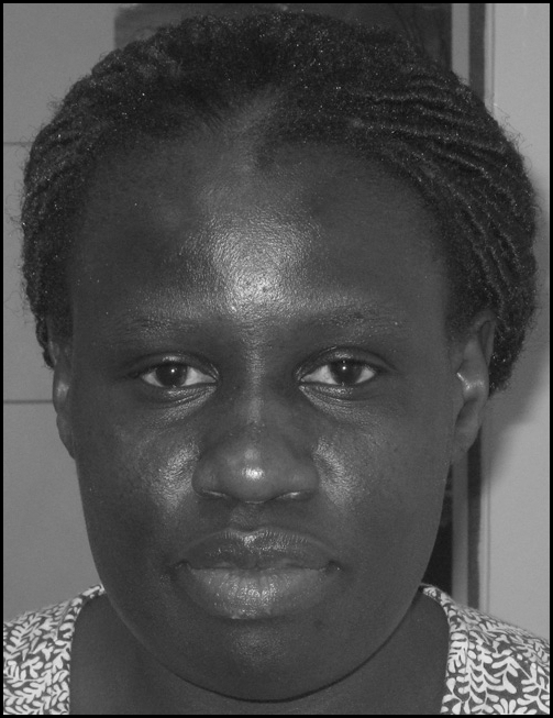 Photo of Gudula Naiga Basaza, Director for Distance Learning Studies at Uganda Martyrs University, with her contact details.