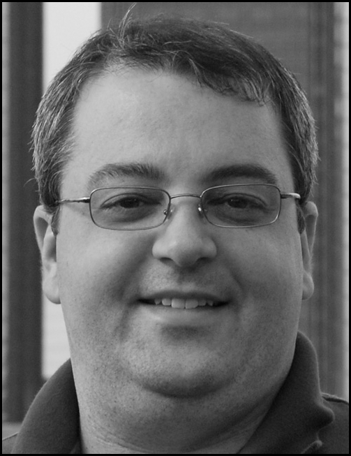 Black and white photo of Michael K Barbour, Assistant Professor with his email address listed.