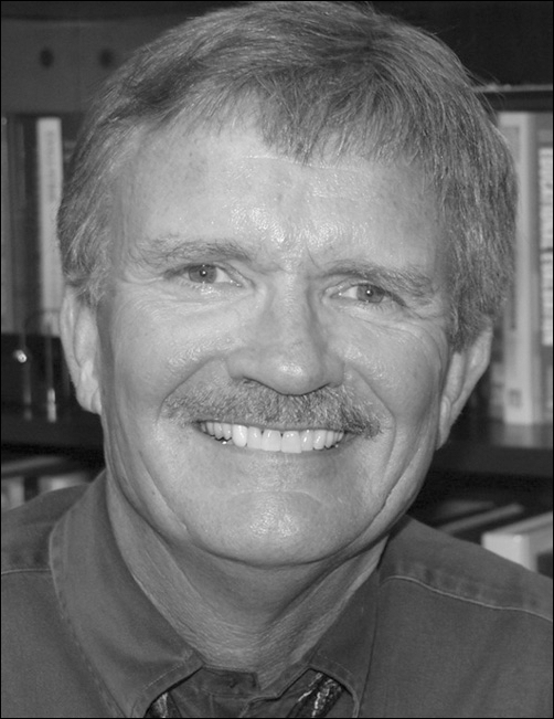 Black and white photo of Michael Simonson along with Role and full Contact Information.