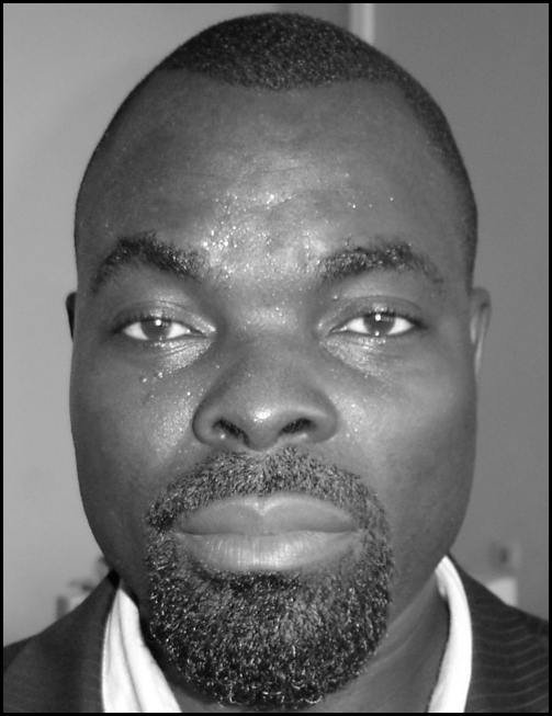 A grayscale head-and-shoulders portrait of an adult person above a block of professional information describing an academic position, university affiliation, country, and email address, all within a thin rectangular border.