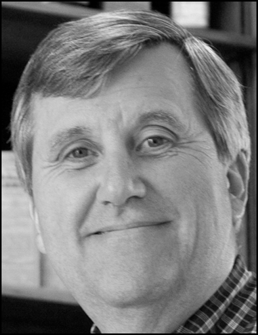 A grayscale head-and-shoulders portrait of an adult person above a block of professional information listing a college affiliation, university address, telephone number, and email, all enclosed within a thin rectangular border.