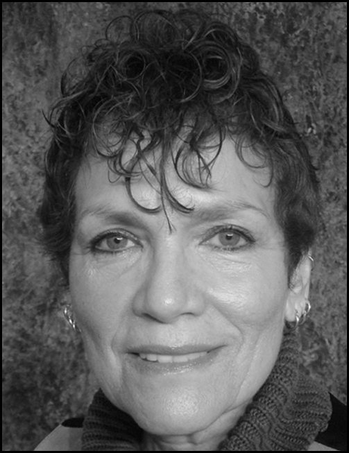 Portrait photograph centered in a bordered box with text below listing her name as Nemir Matos-Cintron. Details such as her job title, organization, mailing address, telephone number, and email address are all givin P.