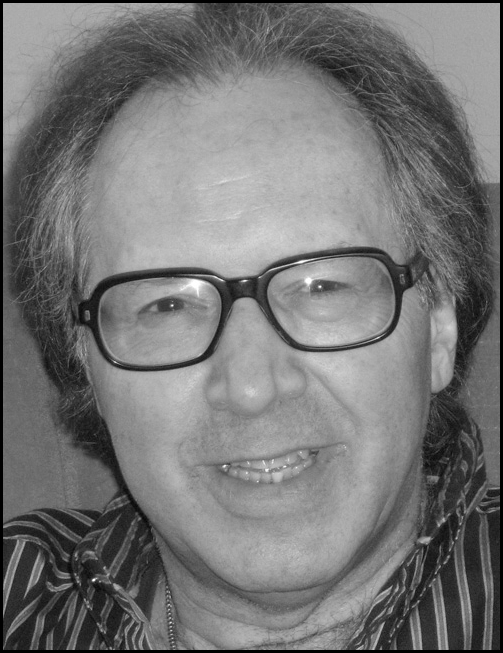 A headshot photograph of a smiling adult wearing glasses, displayed above a text block listing the persons name as Errol Craig Sull, role as an online instructor along with contact details.
