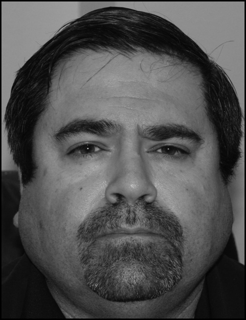 A photograph of Michael T. Kazek.
