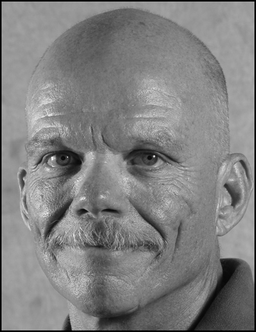 A photograph of Mark Simpson.