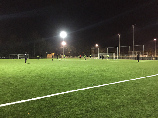Observing football players simulating match situations on a recently installed high-end artificial pitch Refer to the image caption for details.