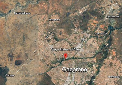 A satellite map of Gaborone shows Segoditshane River, surrounding settlements, and a marked location within the city.