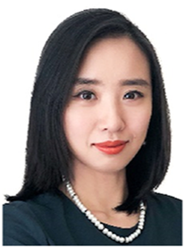 A photograph of Wei Wei, a female figure with shoulder-length hair in a dark top and a necklace against a plain background.