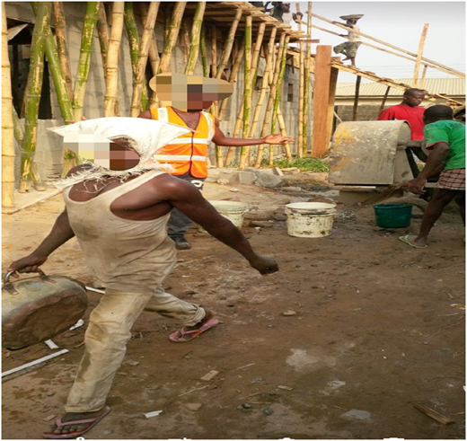 A photograph of artisans working at a construction site.