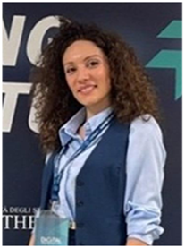 A photo shows Federica Zeuli in formal attire and smiling at the camera.
