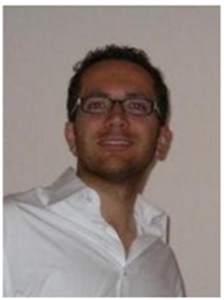 A photo shows Fabian Bernhard in formal dress wearing glasses.