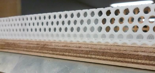 A perforated panel with multiple circular openings mounted along a horizontal structural section.