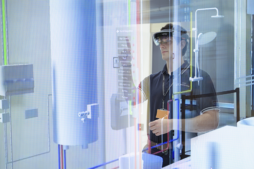 Microsoft Hololens headsets allow users to see a virtual overlay on a physical asset Refer to the image caption for details.