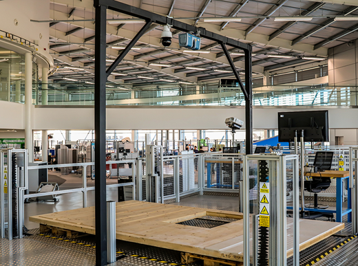 Inspection cell for checking a CLT wall panel using a 3D laser scanner Refer to the image caption for details.