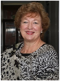 A photograph shows a smiling female figure with curly hair wearing a patterned scarf.