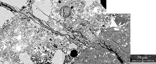 Microscopic image displaying various mineral aggregates with distinct textures and structures, including visible lines and particles, alongside a scale bar measuring fifty micrometres.