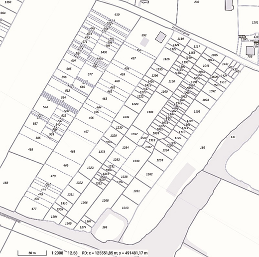 A detailed map depicts parcel numbers and layout. Various numbered plots are organised in a grid, with identifiable pathways and structures.