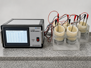 A chloride migration test setup shows a control unit connected to six specimen cells with electrode.