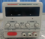 A D C power supply shows ampere, milliampere, and voltage controls with output terminals.