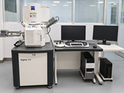 A scanning electron microscope setup shows a Zeiss Gemini Sigma 500 with monitors and control units.