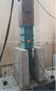 Two views of a laboratory push-out test setup show a steel section between concrete slabs, with chains, sensors, and a loading actuator.