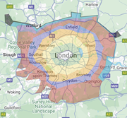 A map of London surrounded by colour-coded zones, showing regions like Watford, Enfield, and Croydon. Key roads and parks are labelled.