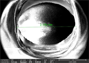 A scanning electron micrograph shows a circular opening with a measured diameter of 2.176 millimetres.