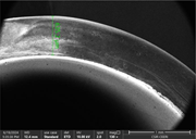 A scanning electron micrograph shows a curved wall section with a measured thickness of 652 micrometres.