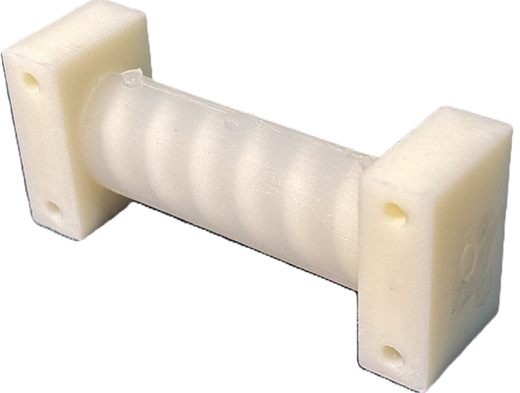 A three-dimensional plastic component resembling a spool with two square ends and a central ribbed cylinder.