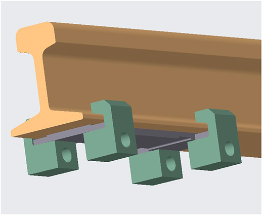 A 3-D model showing an orange rail section with green mounting blocks and a gray grooved sensor assembly attached below.