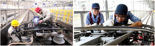 Two technicians inspecting machinery.