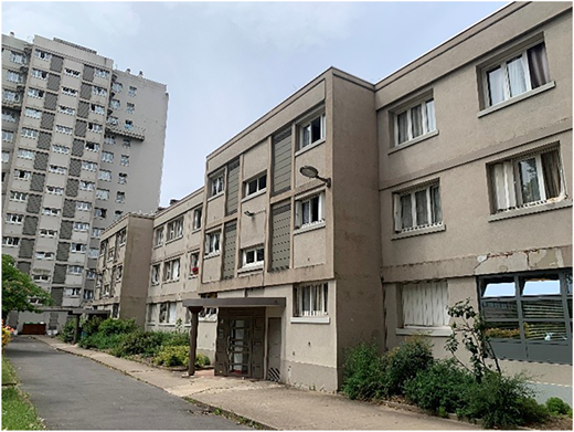 A photograph of a 1950s Paris social housing complex.